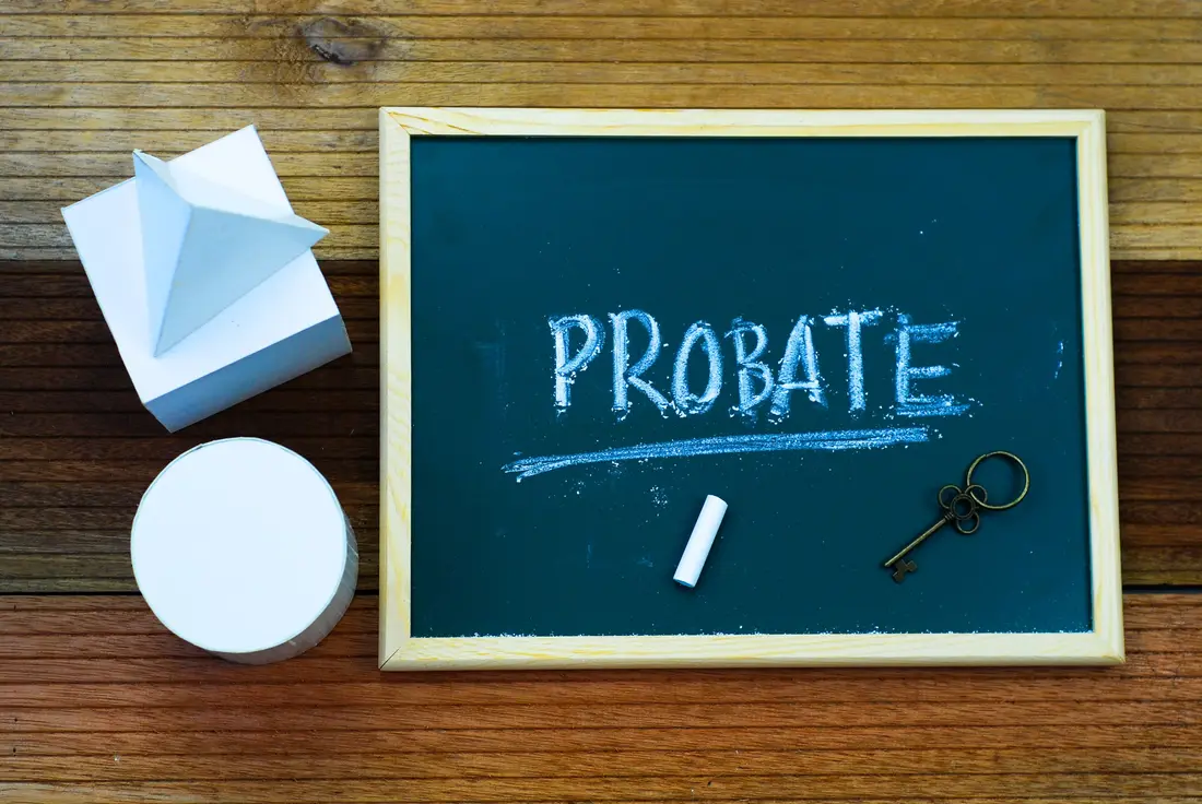 Chalkboard with probate written on it beside a key