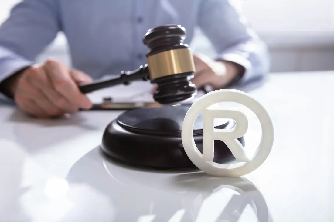 Registered trade mark symbol beside a gavel